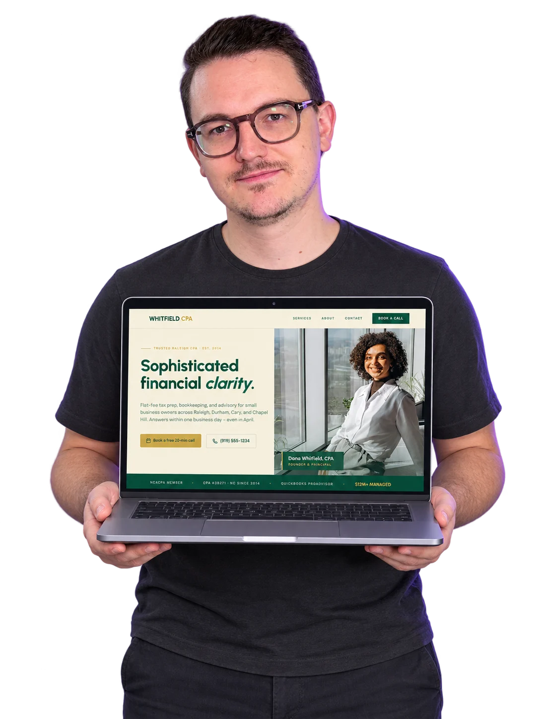 Rino holding a laptop showing a finished website